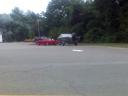 Old Lady Driving a Red 3000GT with a Ricer Wing Pulling a Boat